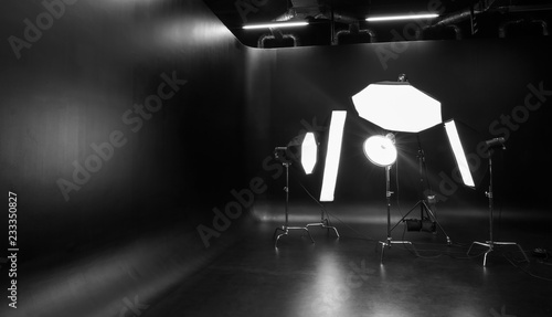 Interior of modern photo studio with professional lighting equipment © Pixel-Shot