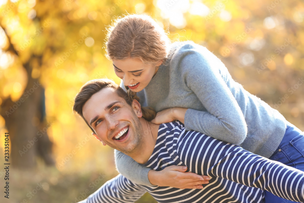 Happy young couple having fun in autumn park Happy young couple having fun in autumn park