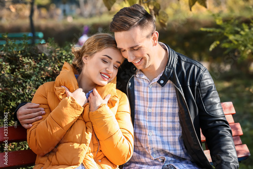 Happy young couple embracin...