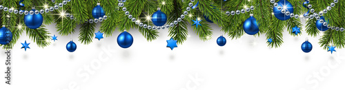 Christmas and New Year banner with fir branches and blue Christmas balls.