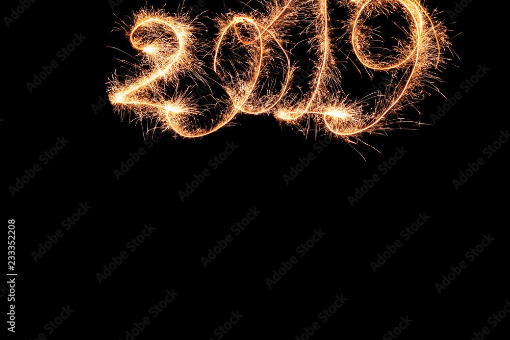 Sparklers forming figures 2019 on dark background