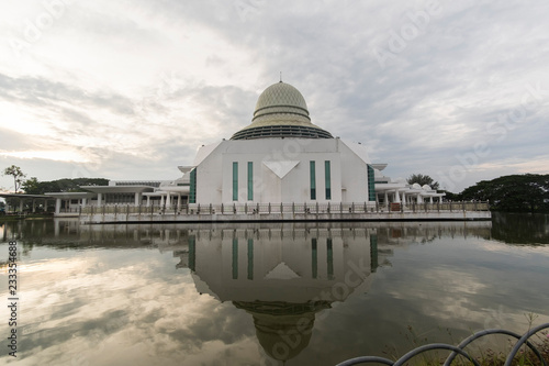 sunrise scenery at public mosque,seri iskandar,malaysia. soft focus,blur due to long exposure. visible noise due to high ISO.