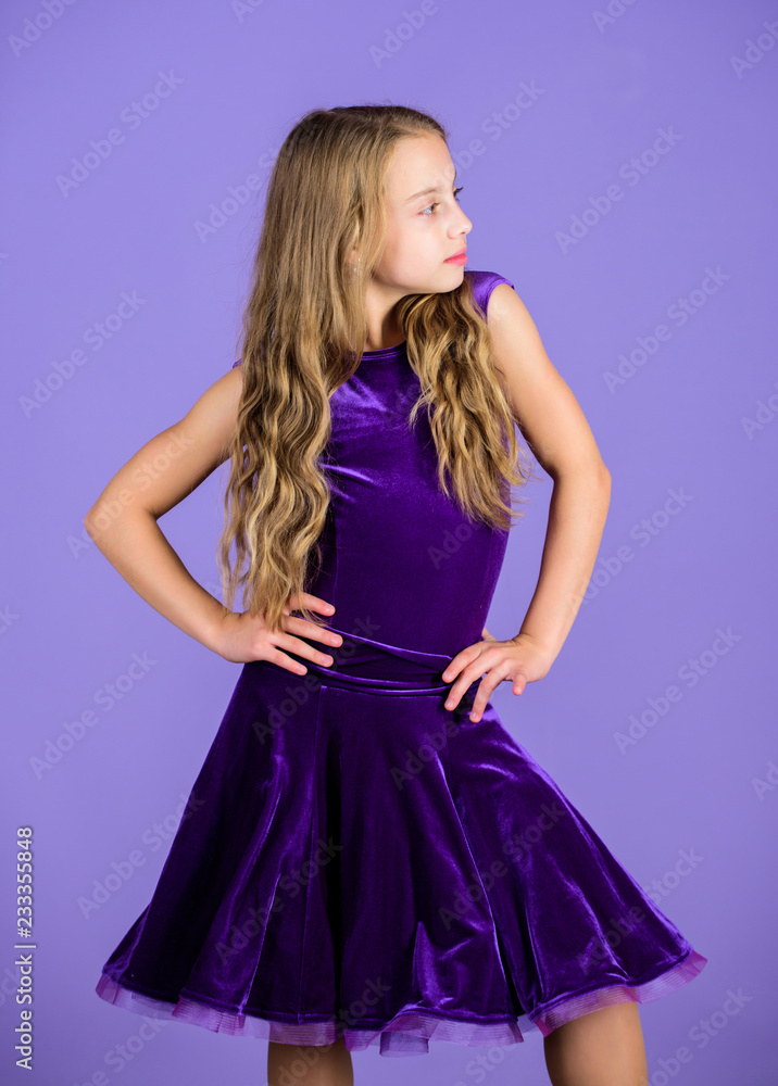 Clothes for ballroom dance. Kid fashionable dress looks adorable. Ballroom dancewear fashion concept. Kid dancer satisfied with concert outfit. Ballroom fashion. Girl child wear velvet violet dress