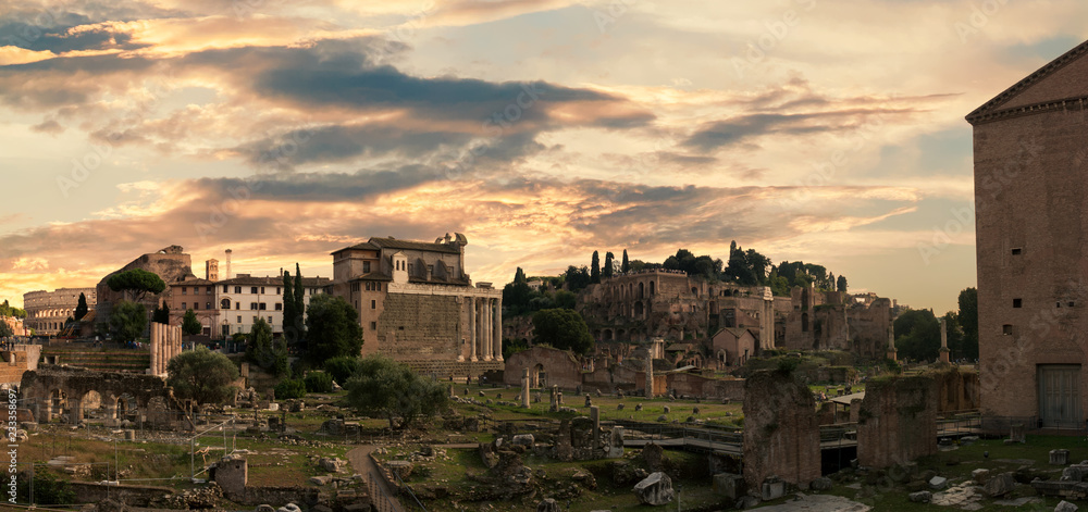 Sunset over the Fori Imperiali ruins, the ancient roman market and forum, Rome, Italy