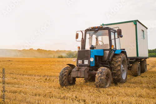 Photography of the big tractor in the field