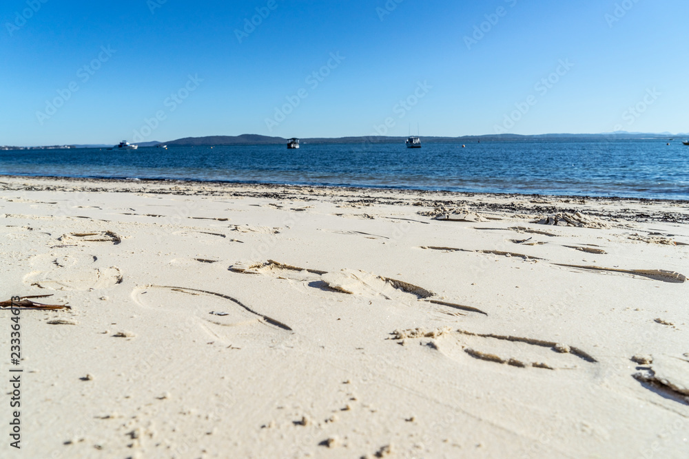 footprints on sandy beach