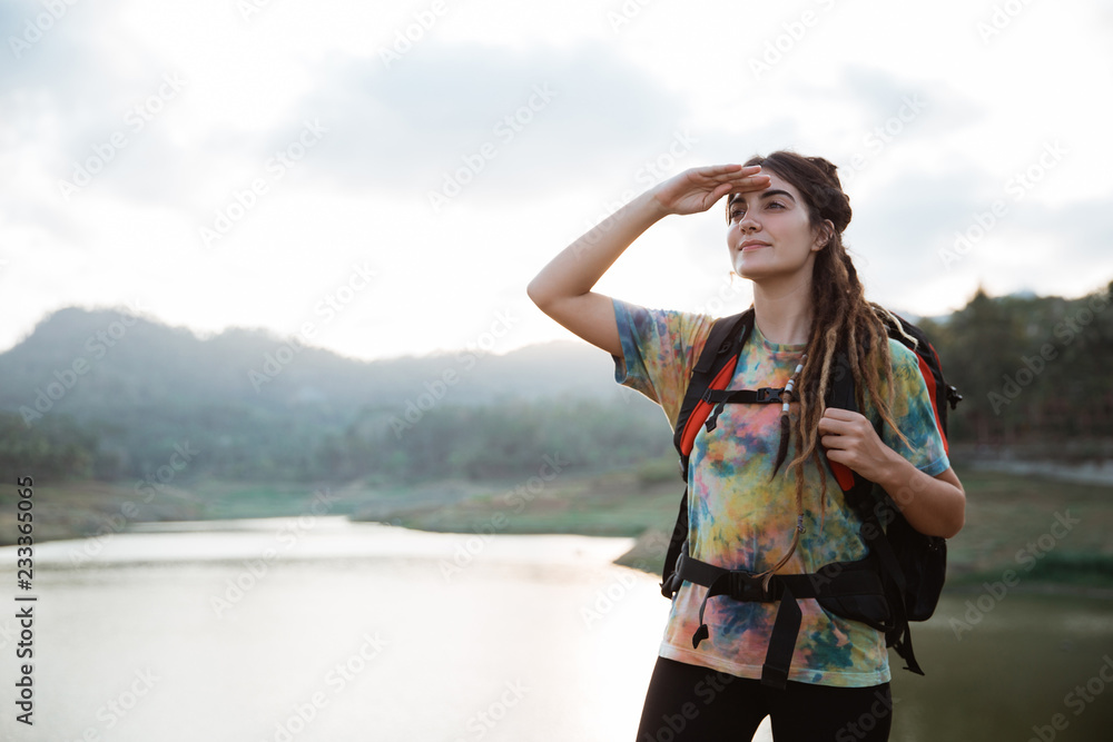 caucasian woman looking around the river caucasian woman looking around the river