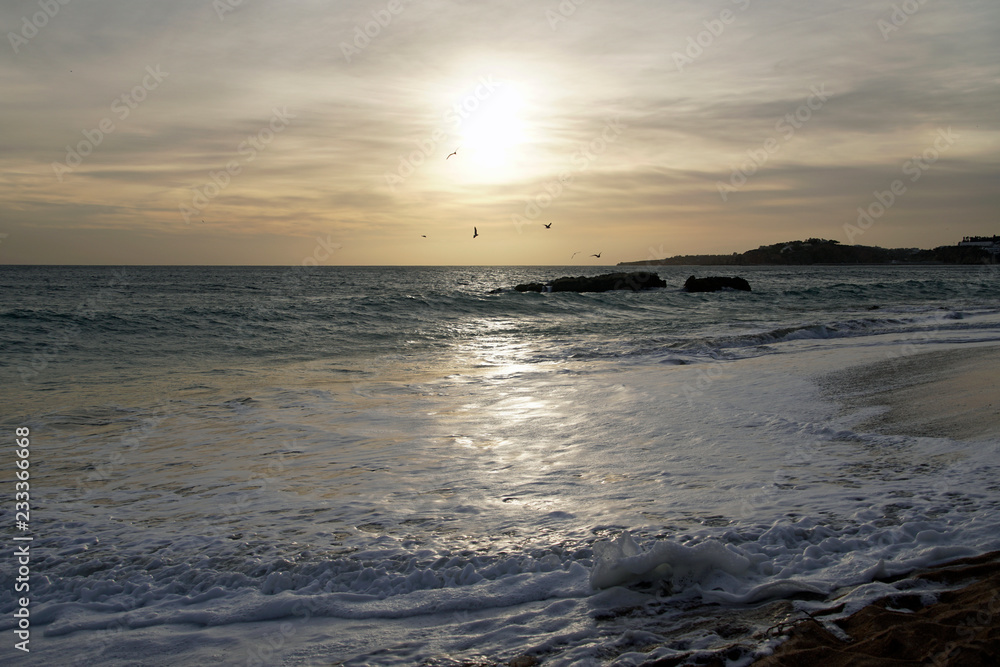 Ocean in the evening. Sunset over the waves. Clouds and bright colors of the evening sky. Ocean in the evening. Sunset over the waves. Clouds and bright colors of the evening sky.