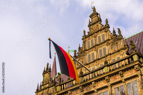 Germany flag mounted on the building Of the city hall in Bremen, Germany on sky background