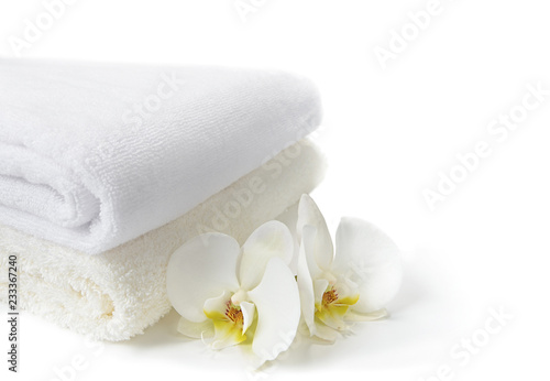 Spa towels with white Orchid flowers on white