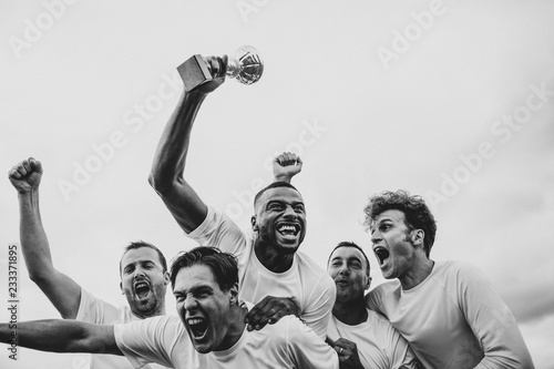 Soccer players team celebrating their victory photo