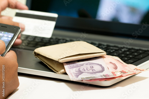 A blurred of credit card and laptop after shopping on line, E-commerce net work marketing concept