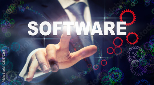Photos A businessman pressing a Software business concept on a graphical display of cog