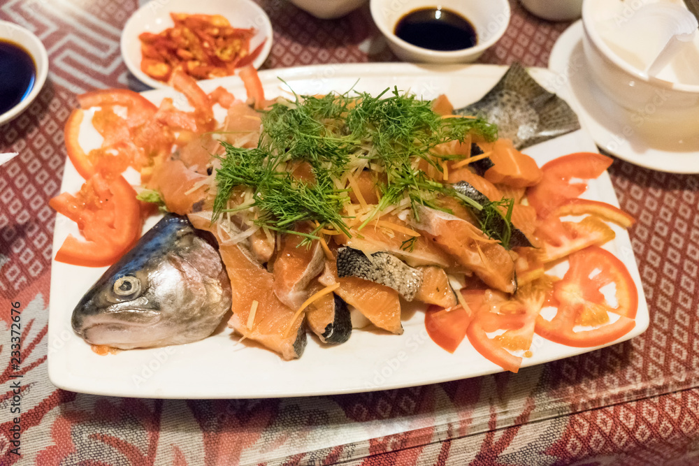 Food fresh Salmon sliced with vegetable and sauce on plate Food fresh Salmon sliced with vegetable and sauce on plate