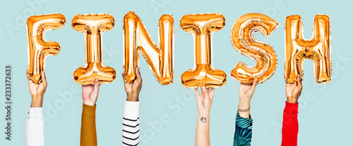 Hands holding finish word in balloon letters photo