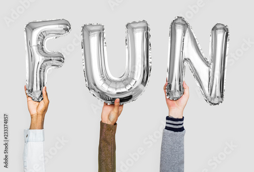 Silver gray alphabet balloons forming the word fun
