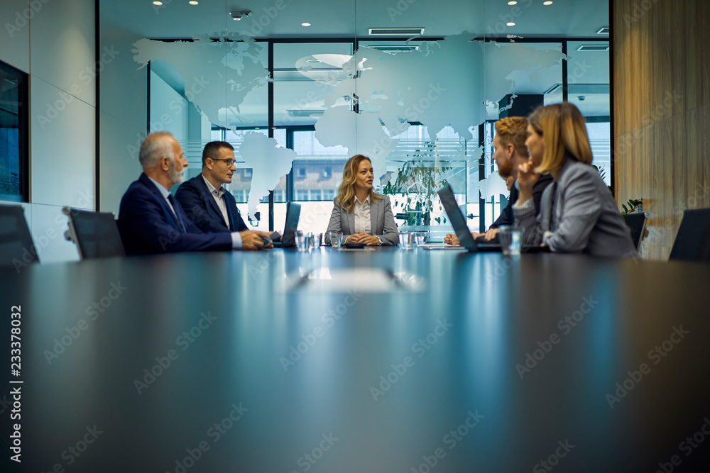 © Westend61 - Group of business people discussing in meeting © Westend61 - Group of business people discussing in meeting