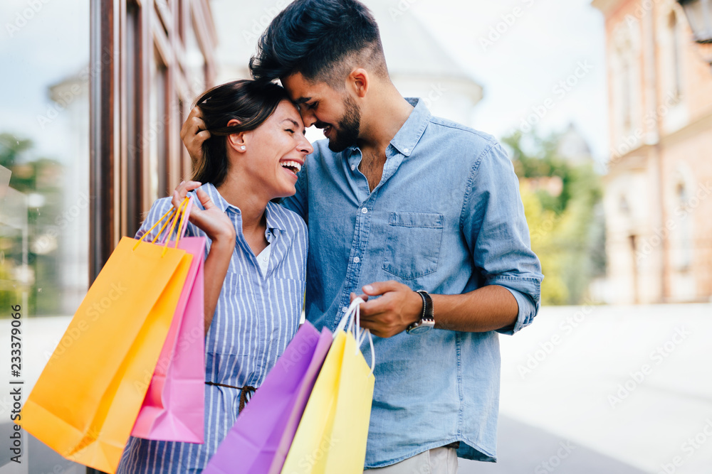 Happy attractive loving couple enjoy shopping together Happy attractive loving couple enjoy shopping together