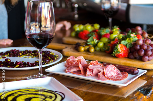Spread of italian meat fruit and wine