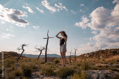 Young woman in the countryside looking out photo