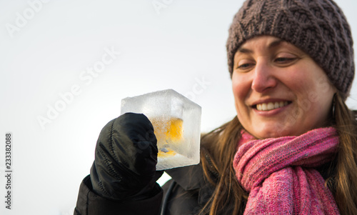 Group of people cheering with cups made out of ice