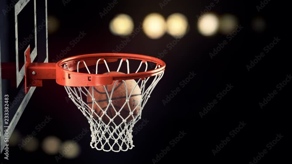 A throw in a basketball ring on a beautiful background A throw in a basketball ring on a beautiful background