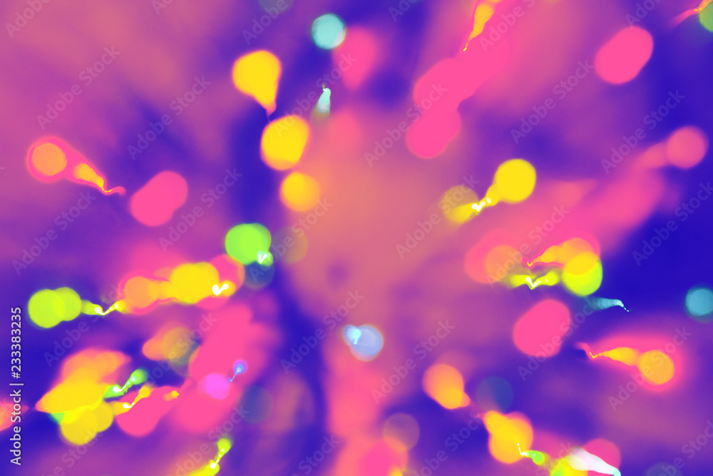 Multicolored festive lights on blue and purple background. Multicolored festive lights on blue and purple background.