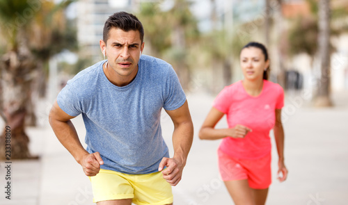 Couple running outdoors