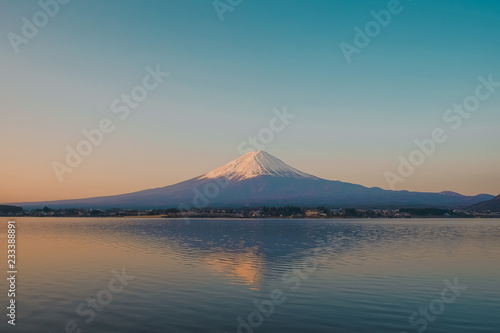 Reflection of Fuji mountain with snow capped in the morning Sunrise at Lake kawaguchiko  Yamanashi  Japan. landmark and popular for tourist attractions