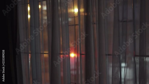 Police light behind window with bars