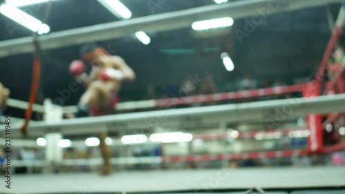 asian boxer slow dance for respect teacher of thai boxing before competition on canvas stadium