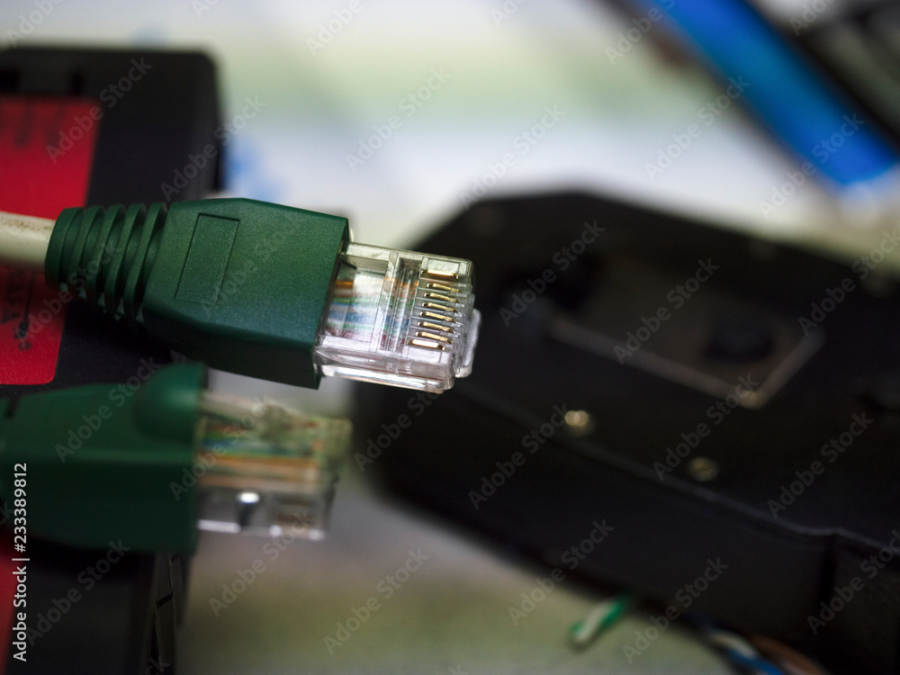UTP ethernet cables.close up macro shot with tools and cables background. UTP ethernet cables.close up macro shot with tools and cables background.