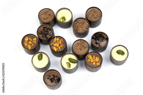 Chocolates on a white background. Isolate. Beautiful sweet candies with different fillings on a white background.