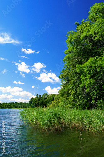 Lake summer landscape over the Wejsunek lake in Wejsuny in Masuria region in Poland photo