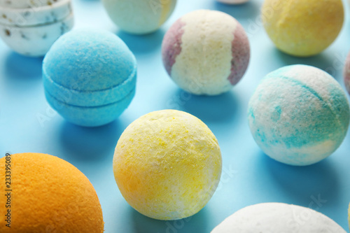 Many different bath bombs on color background