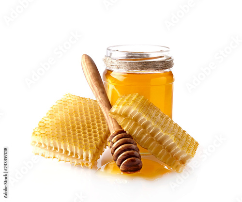 Luquid honey and Honeycomb with wooden spoon