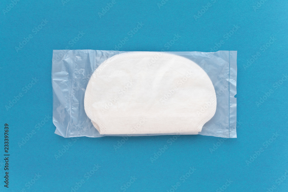 Obraz premium Strip or pads from sweat for the underarms in individual packaging. How to protect clothes from sweat spot. Safe protection from perspiration on cloth
