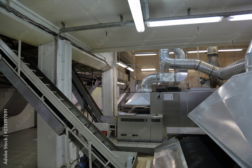 Industrial equipment and machinery at the factory of bread and sweets Industrial equipment and machinery at the factory of bread and sweets