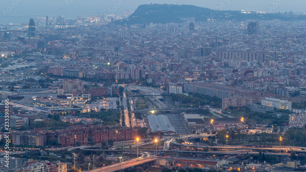 Barcelona and Badalona skyline with roofs of houses and sea on the horizon day to night timelapse