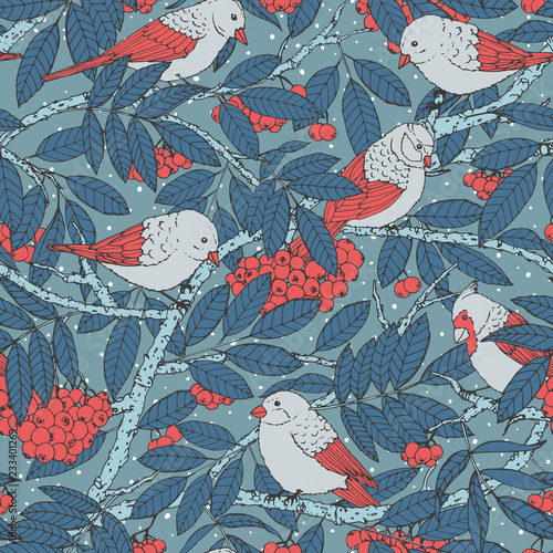 Hand drawn vector seamless pattern with birds, branches, leaves and rowanberry on blue dotted background. Snowy winter decoration ornament for fabric, textile, covers or wrapping paper.