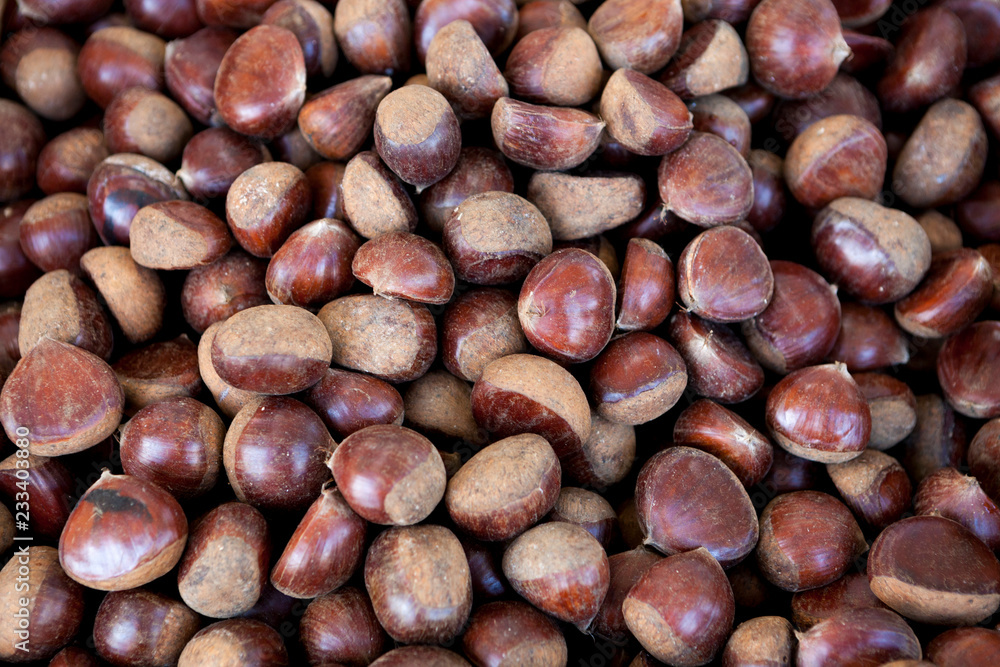 Fresh juicy raw chestnuts. Gourmet appetizer French street food. Photo for the background of a cafe, diner on wheels. Fresh juicy raw chestnuts. Gourmet appetizer French street food. Photo for the background of a cafe, diner on wheels.