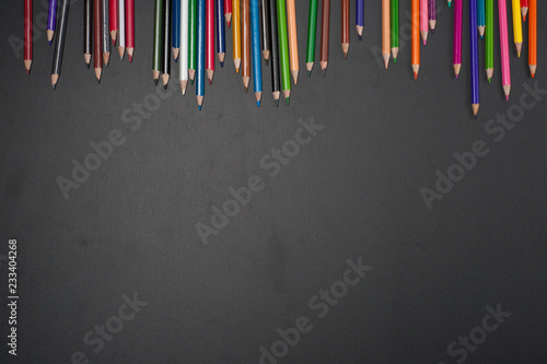 Education school tools on Black Chalkboard Background