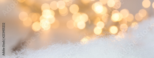 julbanner med julbelysning ofokuserat i bakgrunden vit bomull i förgrunden med utrymme för egen text photo