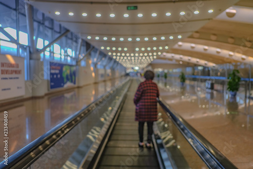 Abstract Blurred Photo of tourist on Walkways in Beijing Capital International Airport