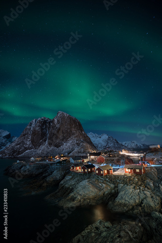 Fisherman village with Aurora in the background travel concept world explore northern light / Lofoten Norway photo