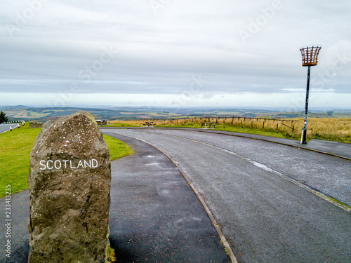 Fotografija Aerial view of the border between Scotland and England with large stone and Scot