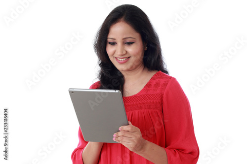 Young happy Woman using a tablet computer against white background