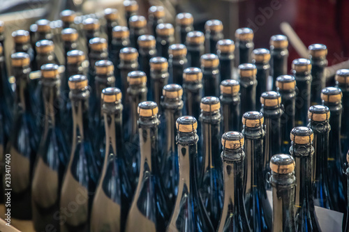 Fresh filled bottles of sparkling wine