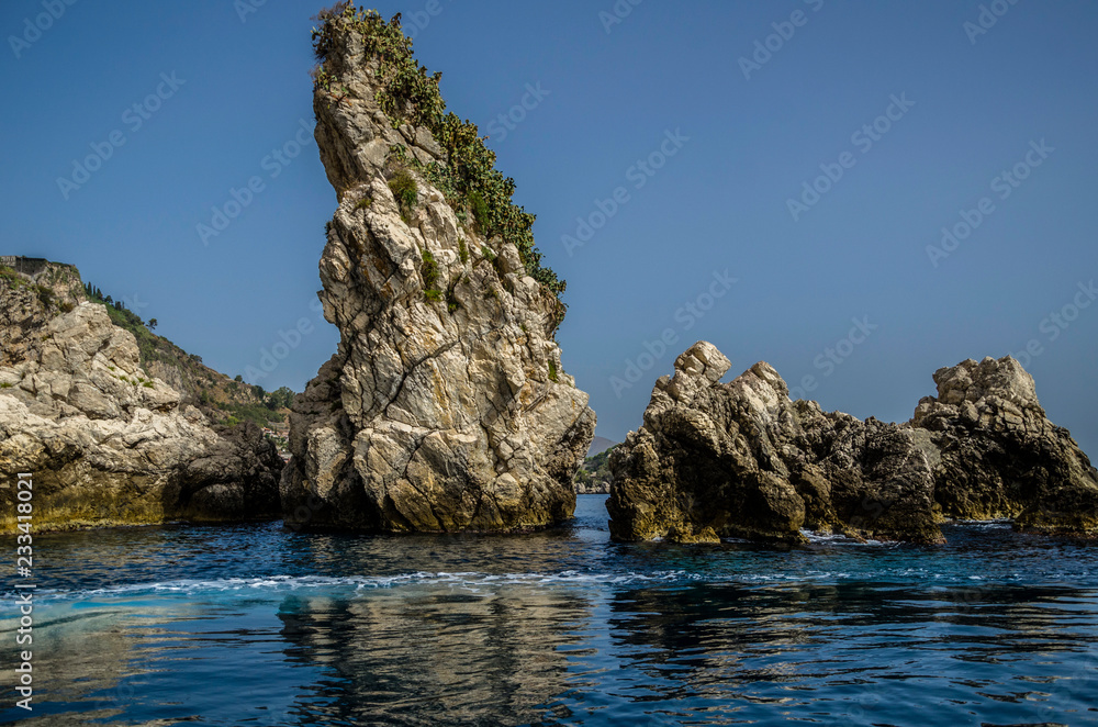 small island and rocks in the sea