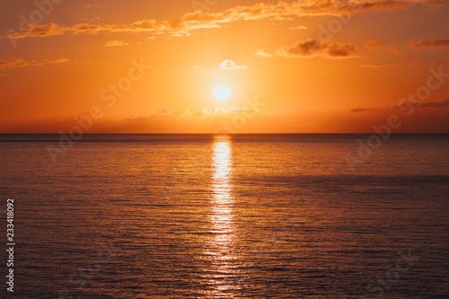 sunrise at ocean seascape with reflection